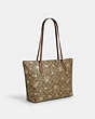 COACH®,ZIP TOP TOTE IN SIGNATURE CANVAS WITH STAR AND SNOWFLAKE PRINT,Coated Canvas,Large,Im/Khaki Saddle/Gold Multi,Angle View