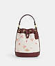 COACH®,DEMPSEY DRAWSTRING BUCKET BAG 15 WITH BOW PRINT,Coated Canvas,Medium,Im/Chalk/Wine Multi,Front View