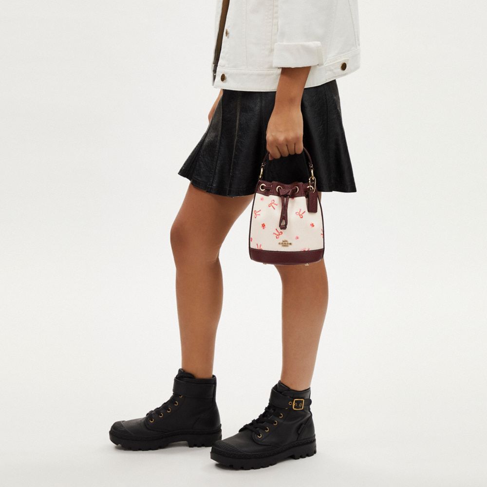 COACH®,Dempsey Drawstring Bucket Bag 15 With Bow Print,,Detail View