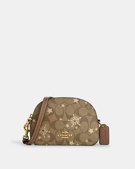 COACH®,MINI SERENA SATCHEL IN SIGNATURE CANVAS WITH STAR AND SNOWFLAKE PRINT,Coated Canvas,Mini,Im/Khaki Saddle/Gold Multi,Front View