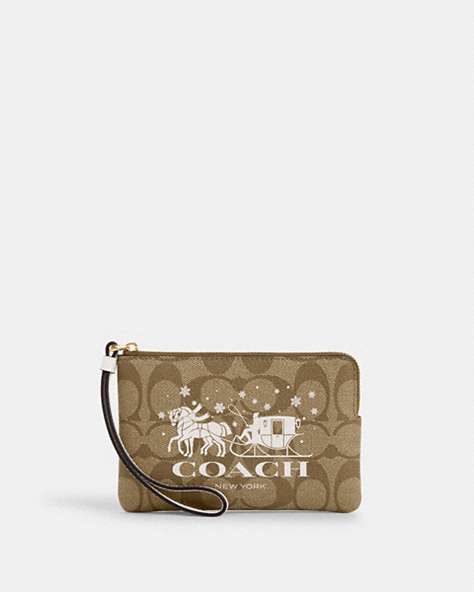 COACH®,CORNER ZIP WRISTLET IN SIGNATURE CANVAS WITH HORSE AND SLEIGH,Coated Canvas,Gold/Khaki/Chalk,Front View