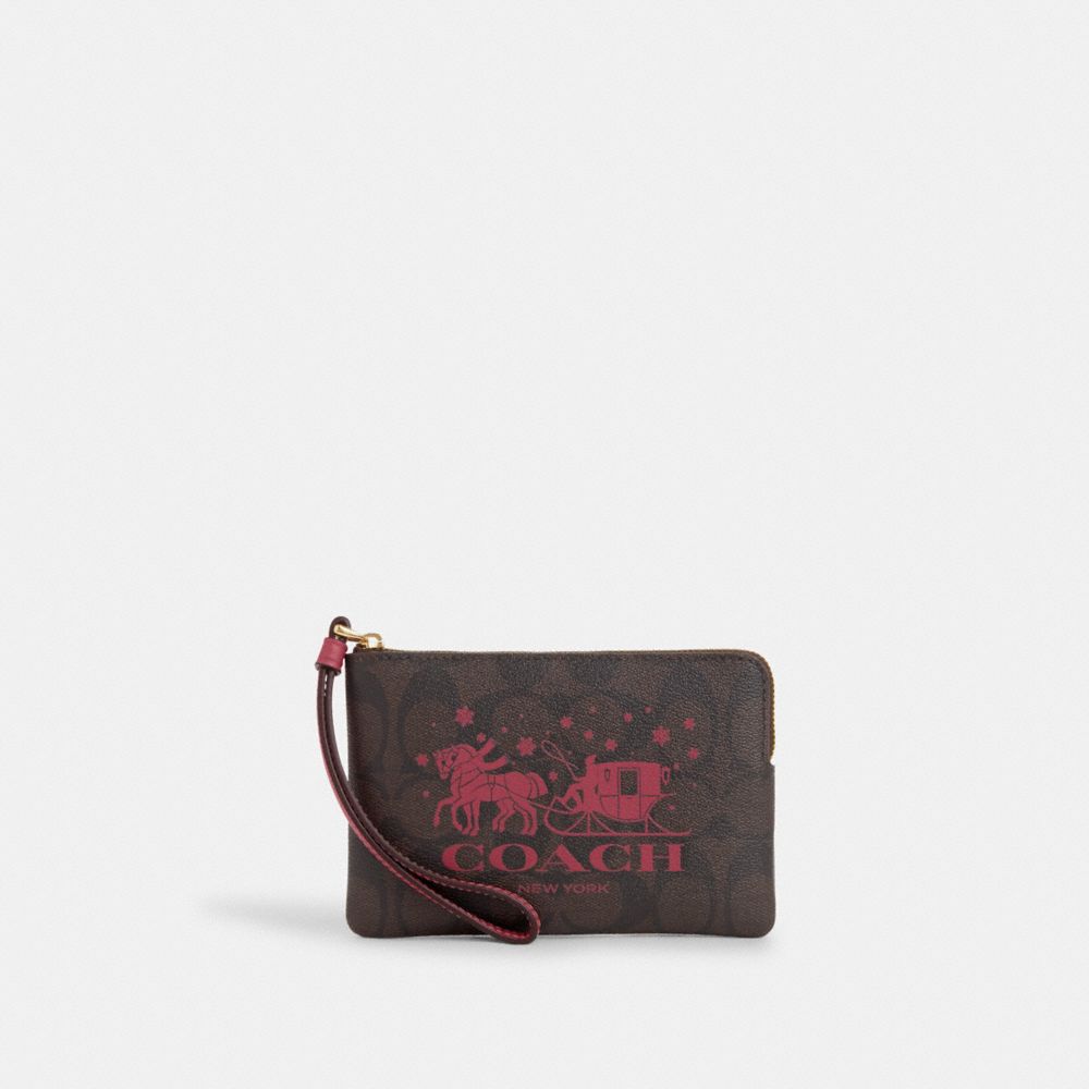 COACH®,CORNER ZIP WRISTLET IN SIGNATURE CANVAS WITH HORSE AND SLEIGH,Signature Canvas,Mini,Im/Brown/Rouge,Front View