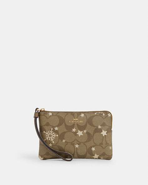 Corner Zip Wristlet In Signature Canvas With Star And Snowflake Print