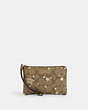 COACH®,CORNER ZIP WRISTLET IN SIGNATURE CANVAS WITH STAR AND SNOWFLAKE PRINT,Coated Canvas,Mini,Im/Khaki Saddle/Gold Multi,Front View