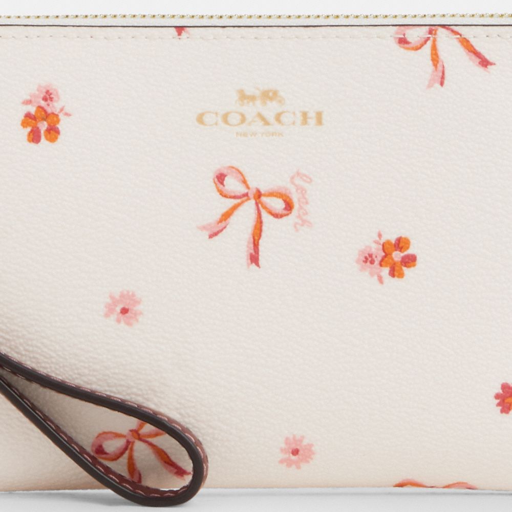 COACH®,Corner Zip Wristlet With Bow Print,