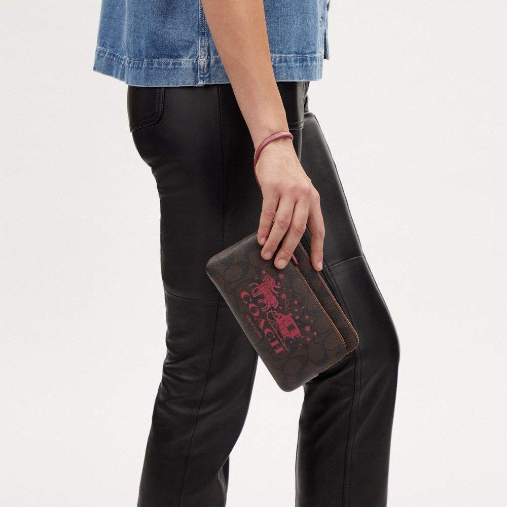 COACH®,Double Zip Wallet In Signature Canvas With Horse And Sleigh,,Detail View