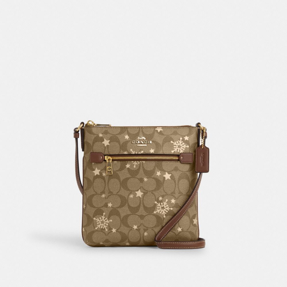 COACH®,MINI ROWAN FILE BAG IN SIGNATURE CANVAS WITH STAR AND SNOWFLAKE PRINT,Signature Canvas,Mini,Im/Khaki Saddle/Gold Multi,Front View