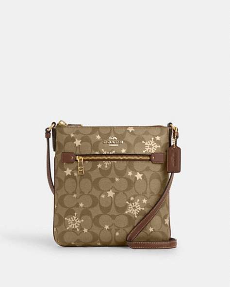 COACH®,MINI ROWAN FILE BAG IN SIGNATURE CANVAS WITH STAR AND SNOWFLAKE PRINT,Coated Canvas,Im/Khaki Saddle/Gold Multi,Front View