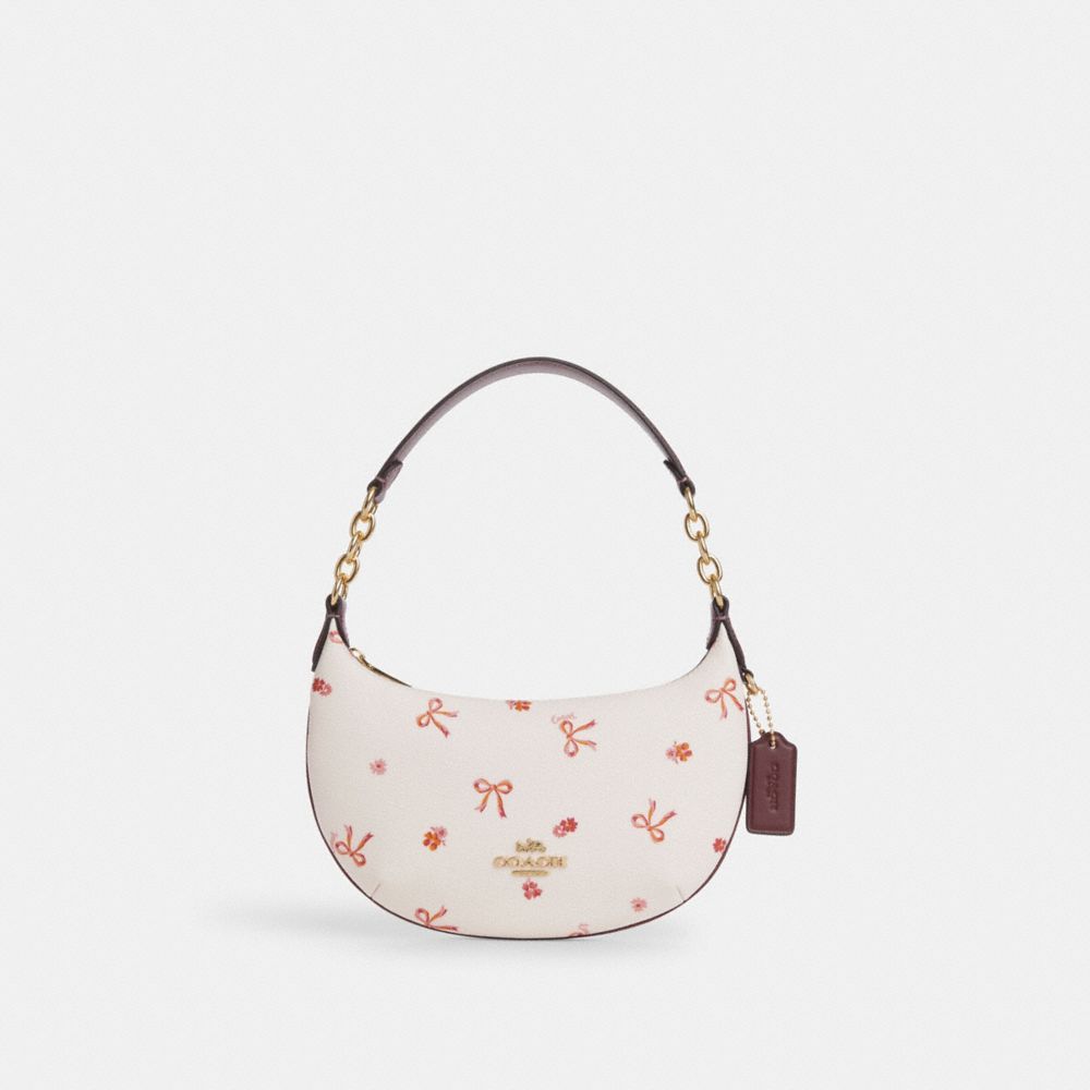 Crossbody bag with outlet bow