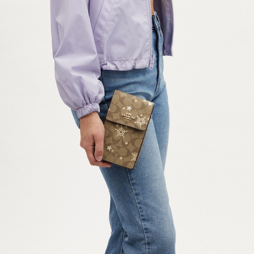 COACH®,Phone Crossbody In Signature Canvas With Star And Snowflake Print,,Detail View