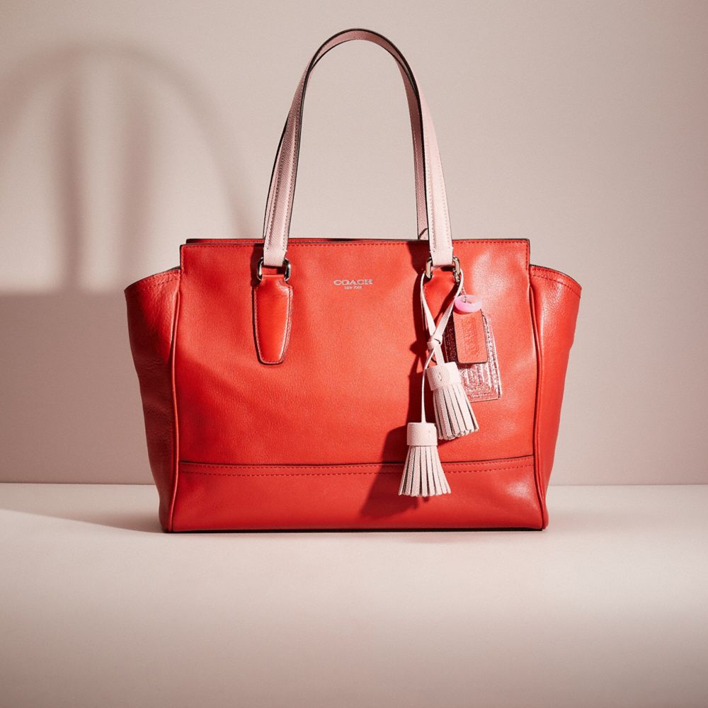 The inside is re-designed with red textile lining and legacy