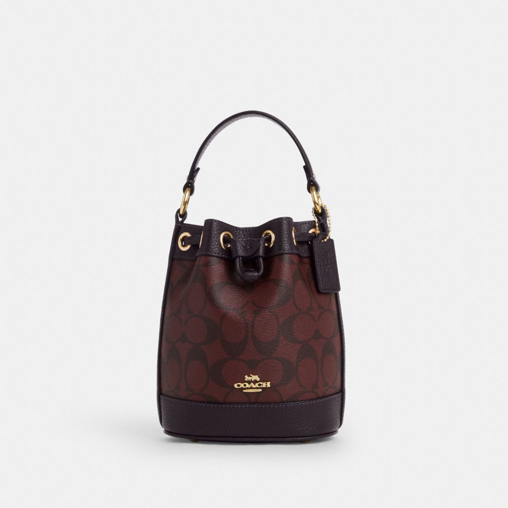 COACH®,DEMPSEY DRAWSTRING BUCKET BAG 15 IN SIGNATURE CANVAS,Signature Canvas,Medium,Gold/Oxblood Multi,Front View