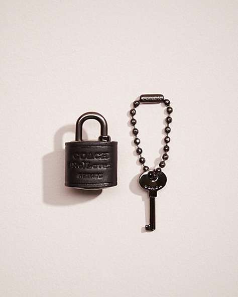 COACH®,REMADE PADLOCK AND KEY BAG CHARM,Black,Front View