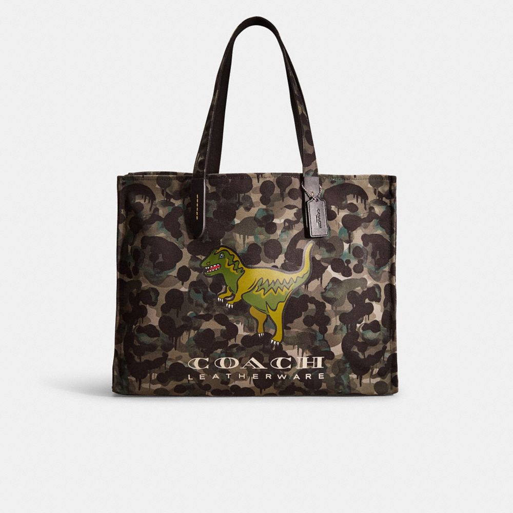 Coach purse with dinosaur on sale