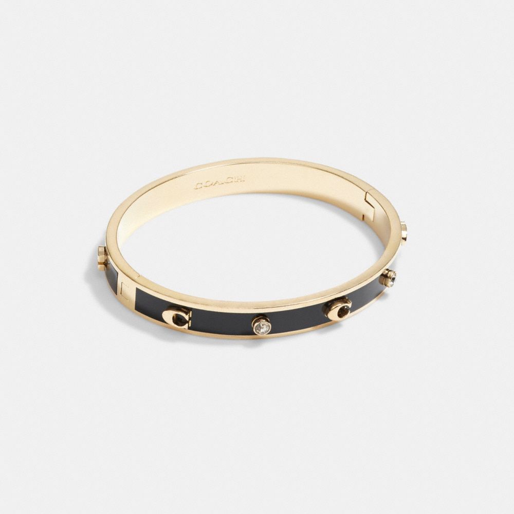 COACH®,SIGNATURE AND STONE HINGED BANGLE,Gold/Black,Front View