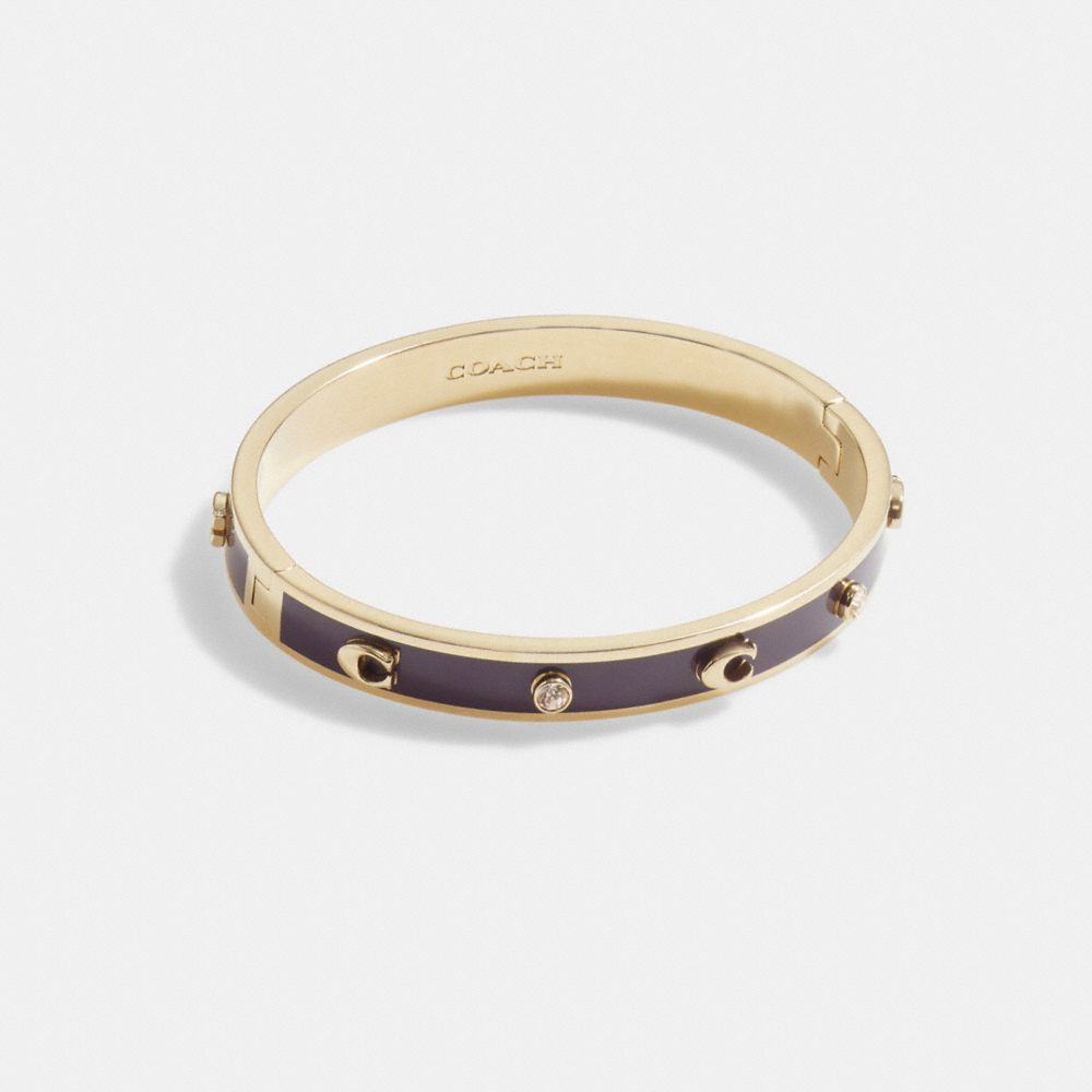 COACH®,SIGNATURE AND STONE HINGED BANGLE,Gold/Wine,Front View