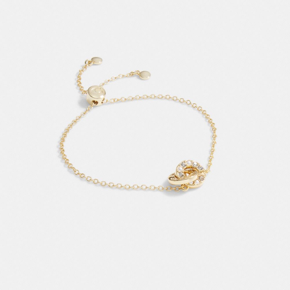 COACH®,INTERLOCKING OPEN CIRCLE PEARL SLIDER BRACELET,Gold/Pearl,Front View