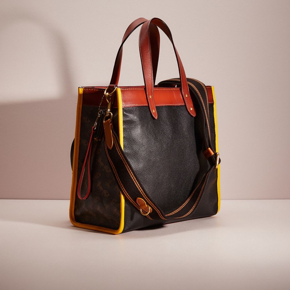 COACH®,Upcrafted Field Tote In Signature Canvas With Horse And Carriage Print,,Angle View