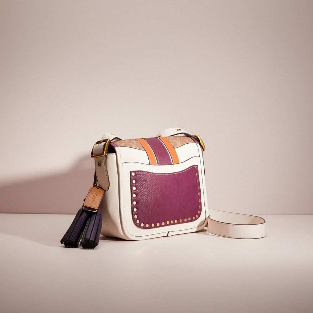 Rambler crossbody discount with varsity stripe