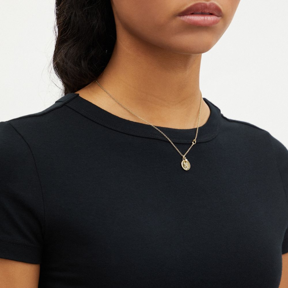 COACH®,COLLIER À PENDENTIF EN FORME DE PIÈCE DE MONNAIE VIERGE,Doré,Detail View