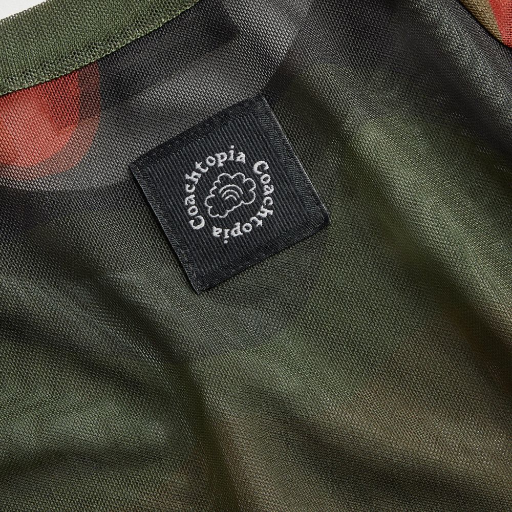 COACH®,Haut en maille avec imprimé ondulé,90 % polyester recyclé, 10 % élasthanne recyclé,Orange profond/Noir multi