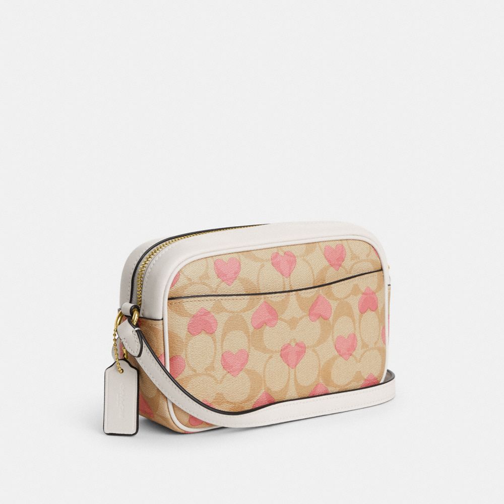 COACH®,MINI JAMIE CAMERA BAG IN SIGNATURE CANVAS WITH HEART PRINT,Signature Canvas,Small,Gold/Light Khaki Chalk Multi,Angle View