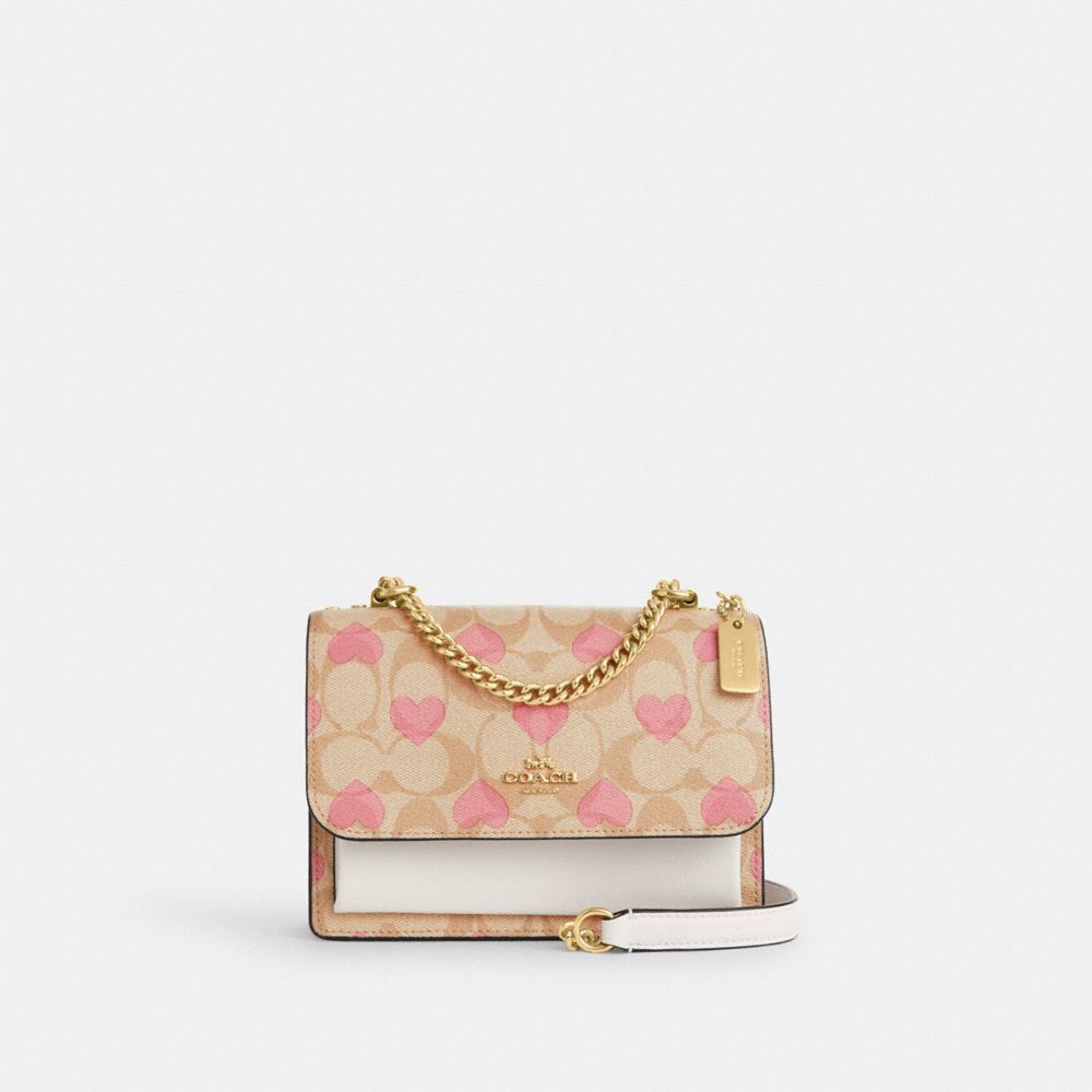 COACH®  Mini Klare Crossbody In Signature Canvas With Heart Print