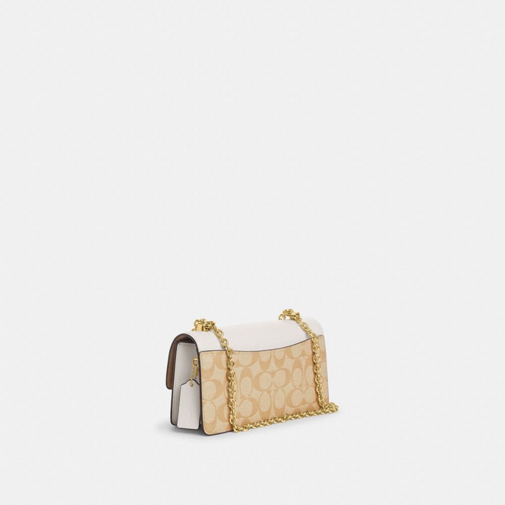 COACH®,ELIZA FLAP CROSSBODY BAG IN SIGNATURE CANVAS,Signature Canvas,Small,Gold/Light Khaki Chalk,Angle View