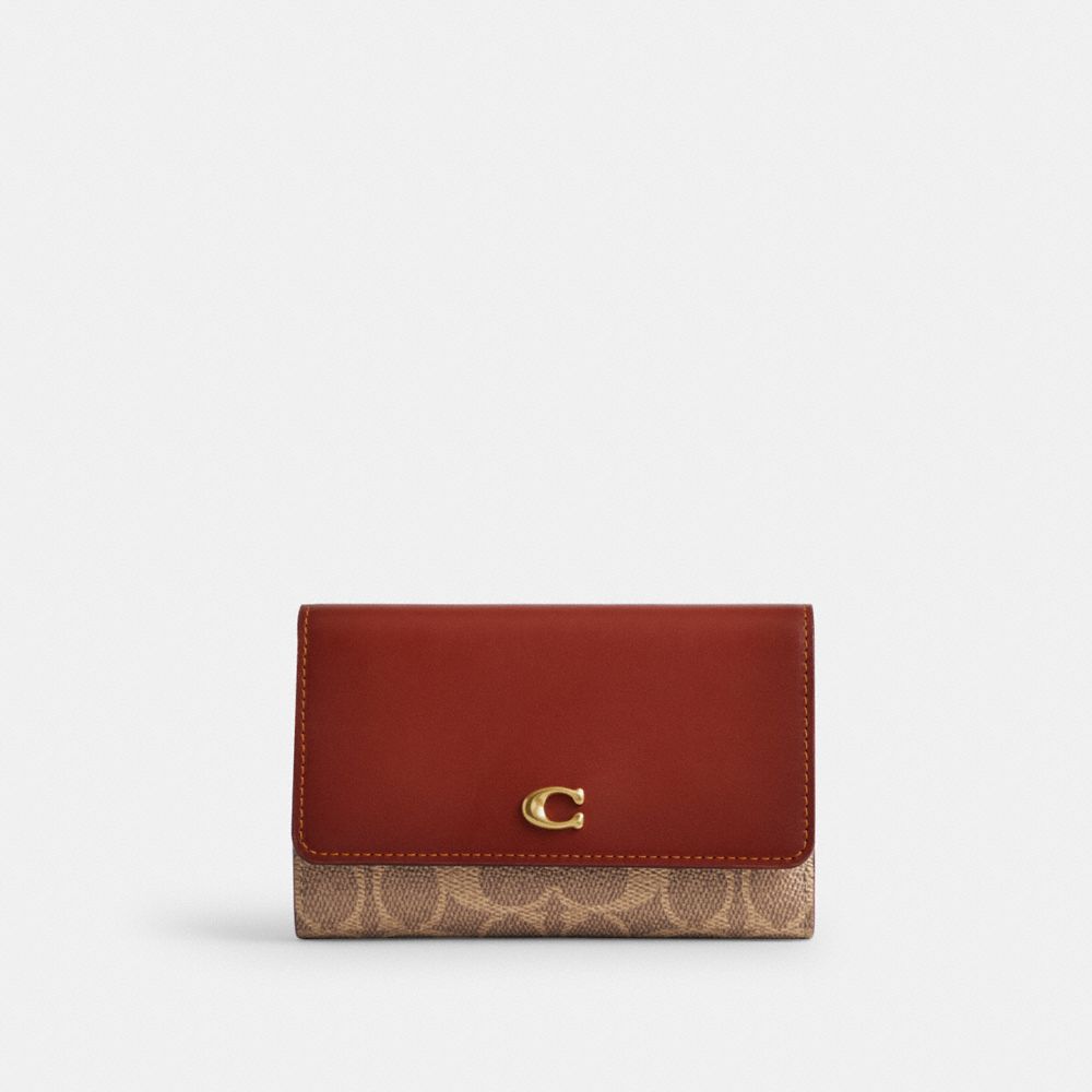 COACH®,ESSENTIAL MEDIUM FLAP WALLET IN SIGNATURE CANVAS,Mini,Brass/Tan/Rust,Front View