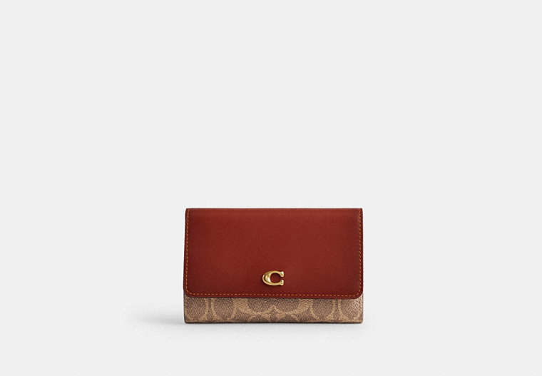 COACH®,ESSENTIAL MEDIUM FLAP WALLET IN SIGNATURE CANVAS,Mini,Brass/Tan/Rust,Front View image number 0