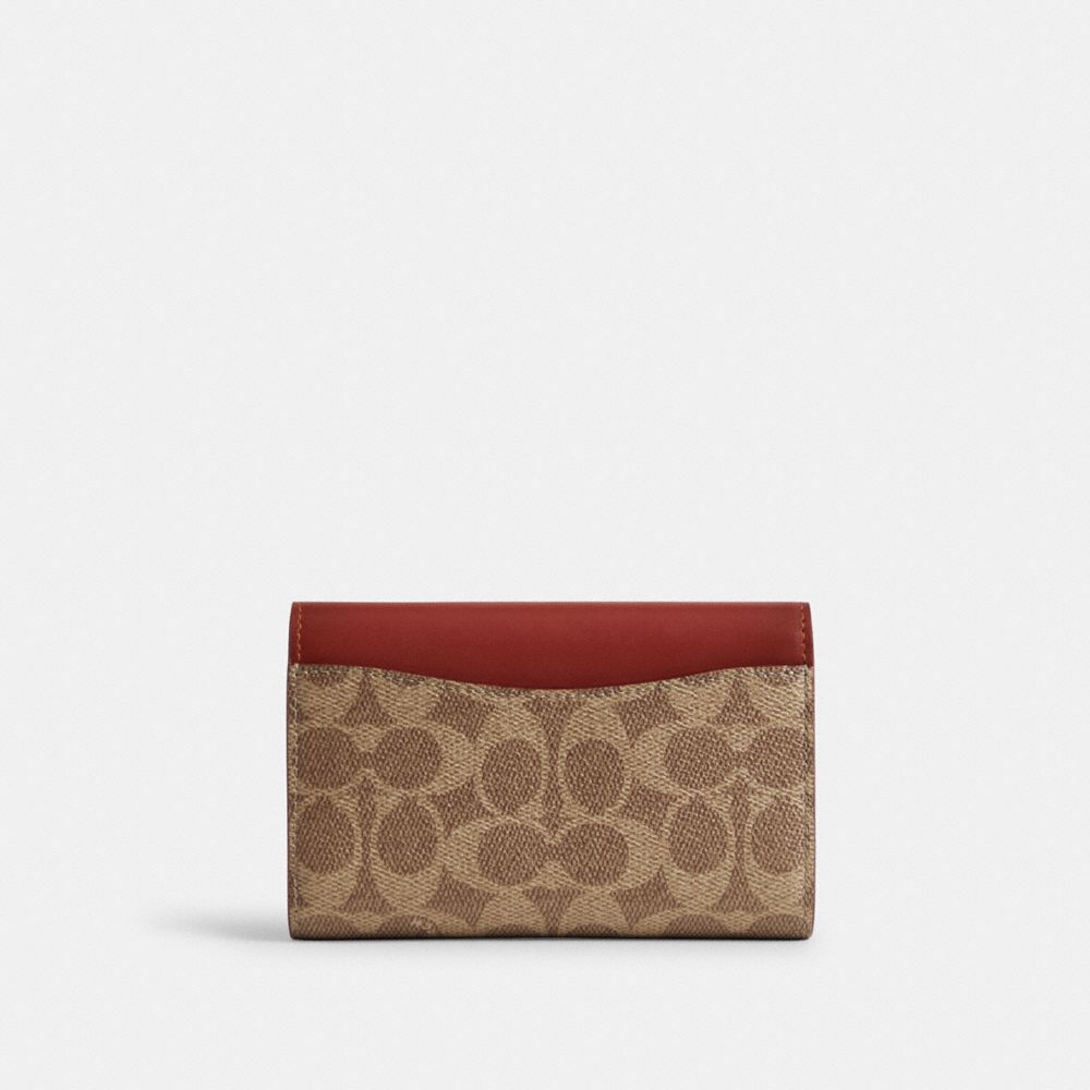 COACH®,Essential Medium Flap Wallet In Signature Canvas,,Back View
