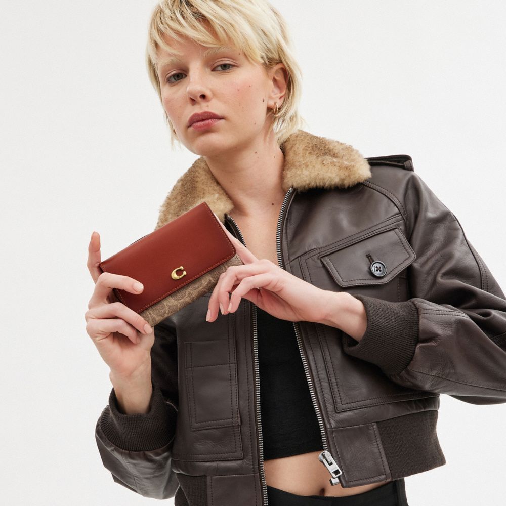 COACH®,Essential Medium Flap Wallet In Signature Canvas,,Detail View