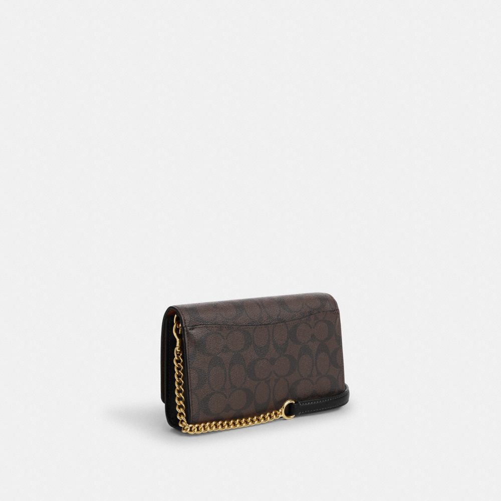 Coach store flap clutch