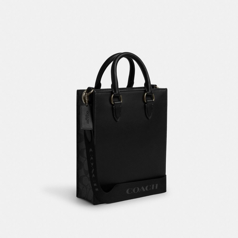 COACH®,DYLAN TOTE BAG IN COLORBLOCK SIGNATURE CANVAS,Signature Canvas,Medium,Gunmetal/Black/Charcoal,Angle View