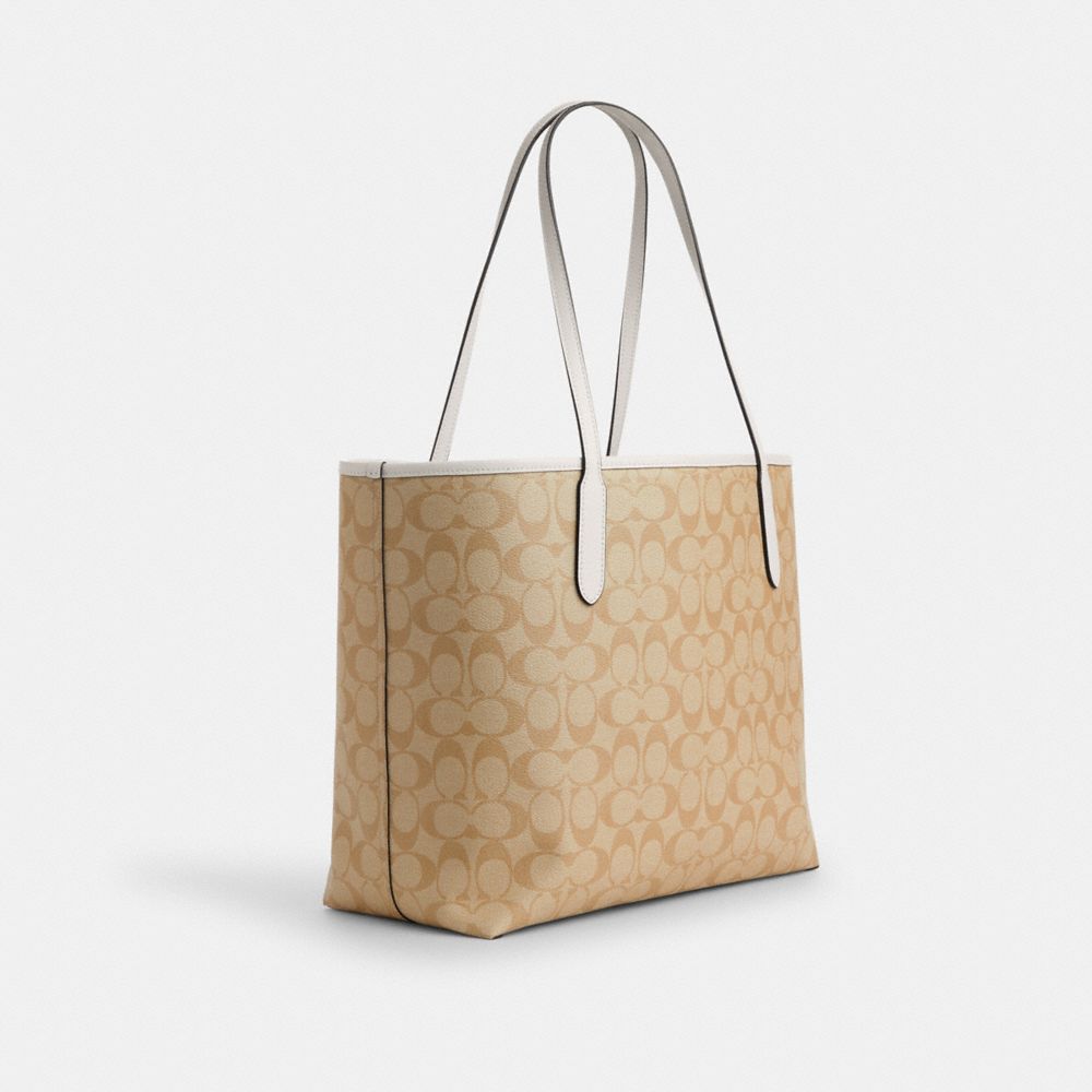 COACH®,CITY TOTE BAG IN SIGNATURE CANVAS WITH HEART PRINT,Signature Canvas,X-Large,Gold/Light Khaki Chalk Multi,Angle View