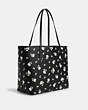 COACH®,CITY TOTE BAG WITH FLORAL PRINT,pvc,X-Large,Silver/Black Multi,Angle View