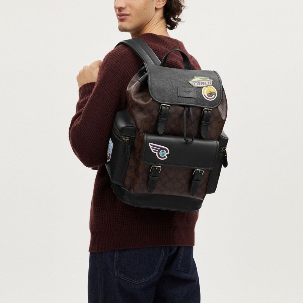 COACH®,Sprint Backpack In Signature Canvas With Travel Patches,,Detail View