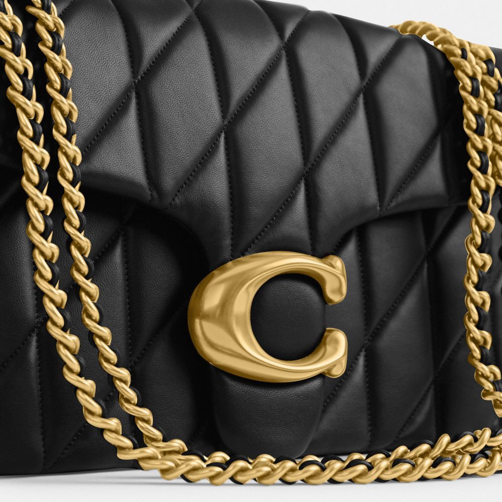 Coach black and gold bag on sale