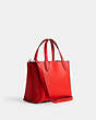COACH®,WILLOW TOTE BAG 24 WITH HEART CHARM,Polished Pebble Leather,Medium,Silver/Sport Red,Angle View