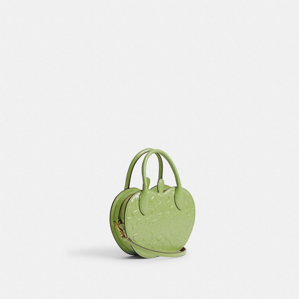 COACH®,APPLE BAG IN SIGNATURE LEATHER,Patent Leather,Small,Brass/Green,Angle View