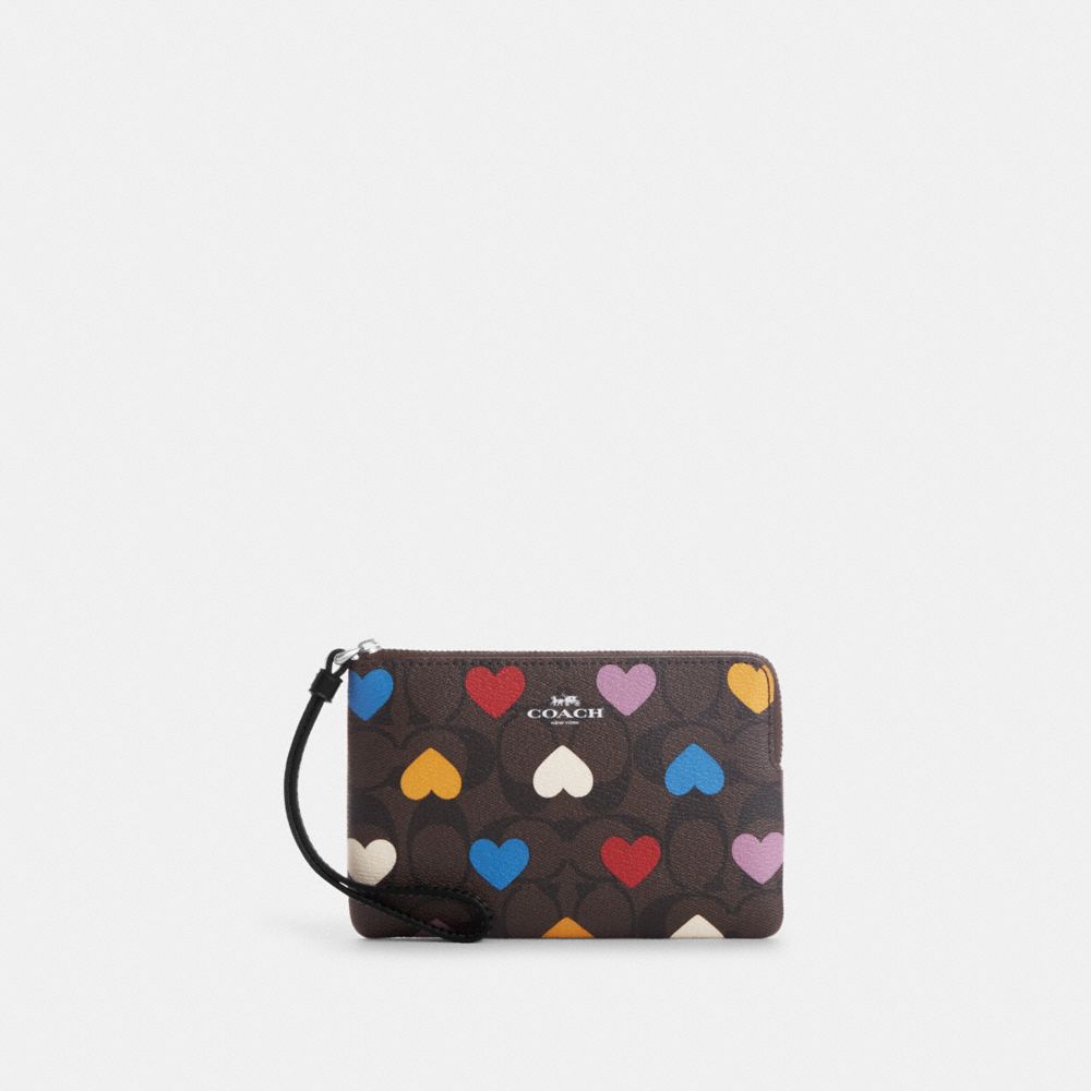 COACH®,CORNER ZIP WRISTLET IN SIGNATURE CANVAS WITH HEART PRINT,Signature Canvas,Mini,Silver/Brown Black Multi,Front View