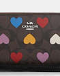 COACH®,LONG ZIP AROUND WALLET IN SIGNATURE CANVAS WITH HEART PRINT,pvc,Mini,Silver/Brown Black Multi
