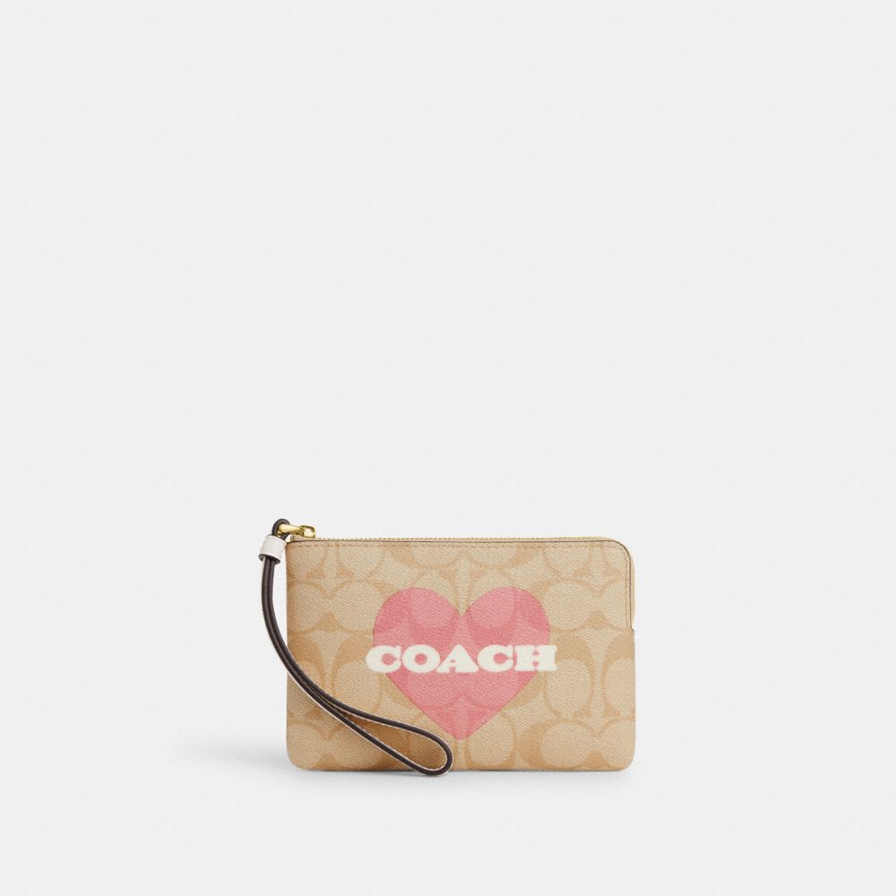 COACH®,CORNER ZIP WRISTLET IN SIGNATURE CANVAS WITH HEART PRINT,Signature Canvas,Mini,Gold/Light Khaki Chalk Multi,Front View