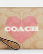 COACH®,CORNER ZIP WRISTLET IN SIGNATURE CANVAS WITH HEART PRINT,pvc,Mini,Gold/Light Khaki Chalk Multi