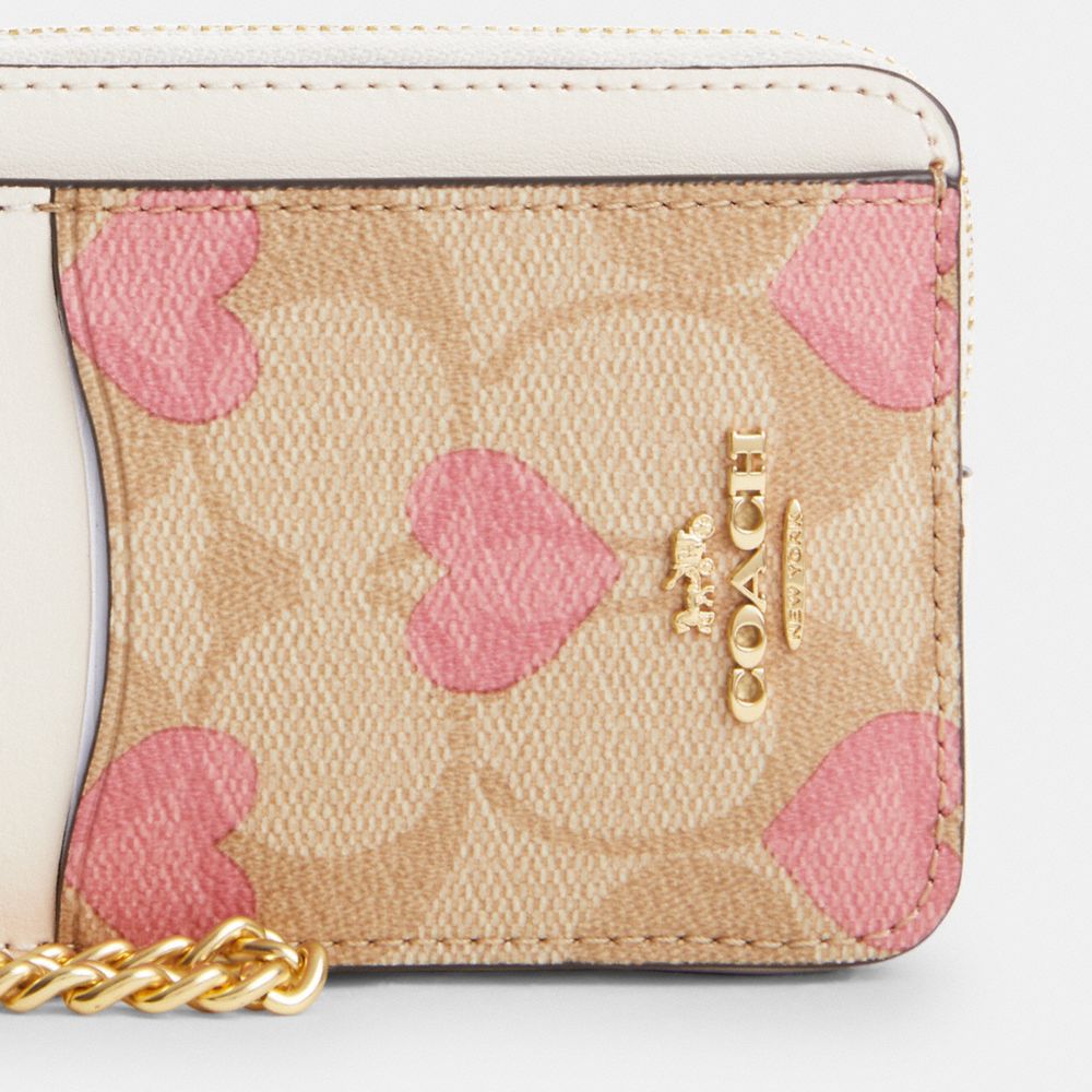 COACH®,ZIP CARD CASE IN SIGNATURE CANVAS WITH HEART PRINT,Signature Canvas,Mini,Gold/Light Khaki Chalk Multi