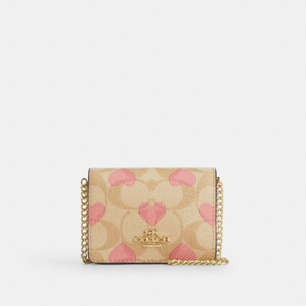 COACH®,BOXED MINI WALLET ON A CHAIN IN SIGNATURE CANVAS WITH HEART PRINT,Signature Canvas,Mini,Gold/Light Khaki Chalk Multi,Front View