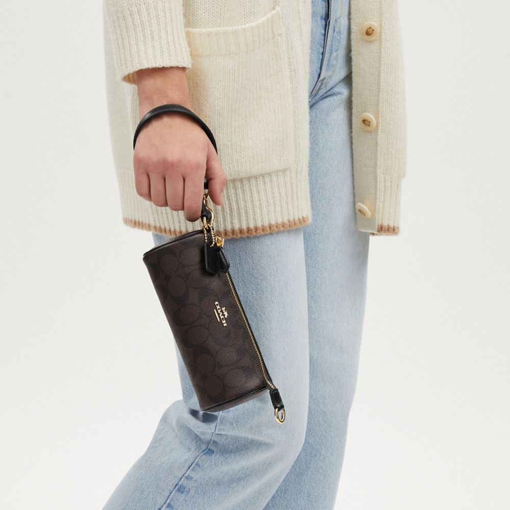 COACH®,Nolita Barrel Bag In Signature Canvas,Canvas,Cotton,Leather,Baguette,Logo,Gold Metal,Casual,Brown,Detail View