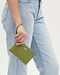 COACH®,CORNER ZIP WRISTLET,Pebbled Leather,Mini,Silver/Yellow Green,Detail View