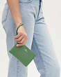 COACH®,CORNER ZIP WRISTLET,Pebbled Leather,Mini,Silver/Soft Green,Detail View