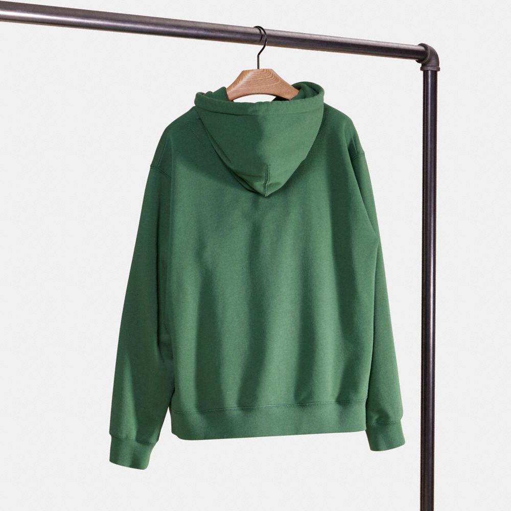 COACH®,Restored Horse And Carriage Hoodie In Organic Cotton,Organic Cotton,Sweatshirt,Sweater,Drawstring,Sustainable,Casual,Green,Back View